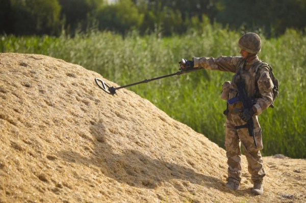 Metal Detector Haystack [U.S. Marine Corps photo by Lance Cpl. James Purschwitz/Released]